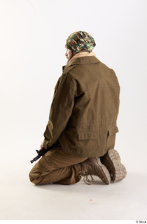 Andrew Elliott Insurgent Kneeling holding gun kneeling whole body 0003.jpg